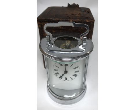 An unusual circular design chrome plated 4 glass carriage clock and case.