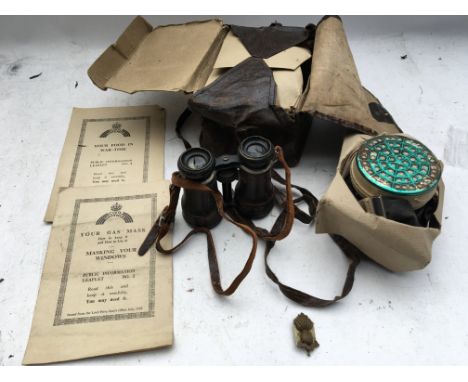 World war ll bagged gas mask with public information leaflet, a pair of binoculars and a cap badge - NO RESERVE