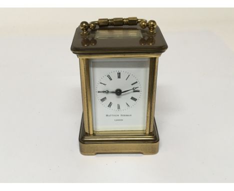 A miniature brass carriage clock the dial with the inscription Matthew Norman - NO RESERVE