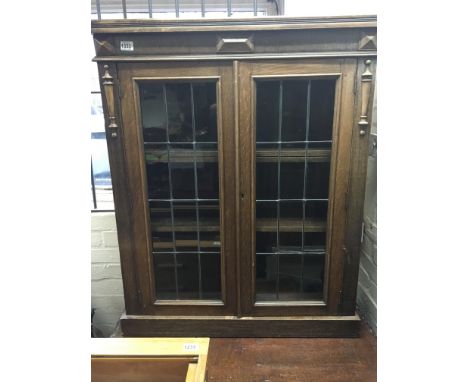 An oak bookcase with lead light panels - NO RESERVE