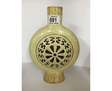 A pottery moon flask with with oriental decoration. 26cm.