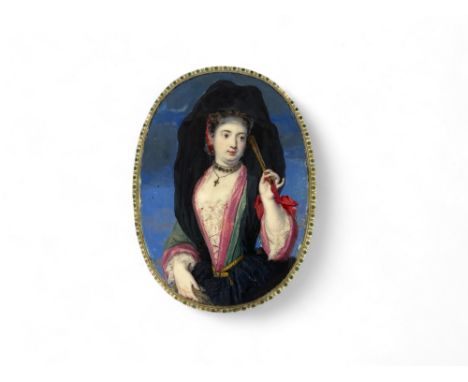 An 18th century oval ivory portrait miniature of a lady wearing a black hood with fan
The reverse engraved with leaves and gr