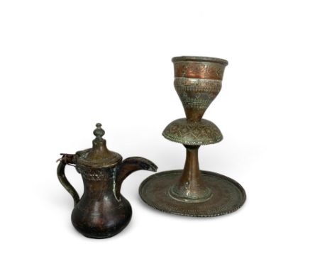 Two late 19th century Persian tinned copper items
Comprising of an engraved tiered candlestick on a circular base, 33cm high,