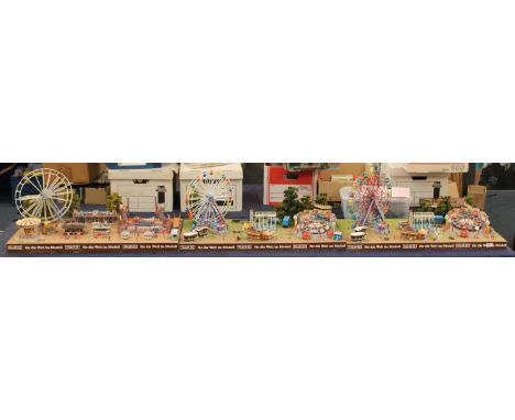 Large shop display advertisement model for Faller in three sections modelled as a funfair with waltzer, chairoplanes, boat sw