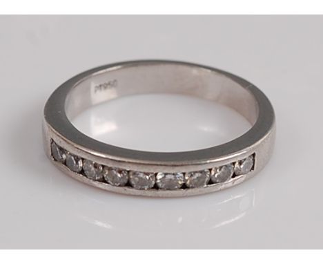 A platinum diamond half-hoop eternity ring, comprising nine round brilliant cut diamond in channel setting, diamond dimension