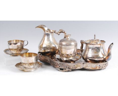 A Chinese 'silver' tea-for-two service, comprising shaped oval tray, teapot, sucrere and cover on stand, cream jug, and two t