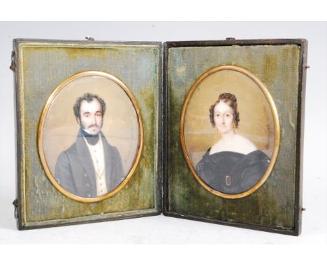 Adolphe Henri Dubasty (1814-1884) - a cased pair of portrait miniatures, being half-length studies of a lady and gentleman, h