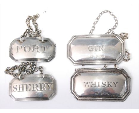 A pair of George IV silver decanter collars, annotated for Sherry and Port, on chains, maker Charles Rawlings, London 1823, w