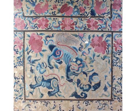 A 19th century Chinese silkwork panel, depicting dragons amidst flowers and foliage and within a border, 85 x 83cm, in Europe