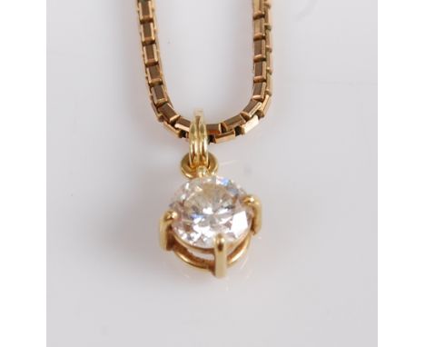 A yellow metal diamond single stone pendant, featuring a round brilliant cut diamond in a four-claw compass setting, diamond 