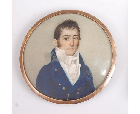 Early 19th century English school - Half-length portrait of a young man wearing a blue tunic, miniature watercolour on ivory,