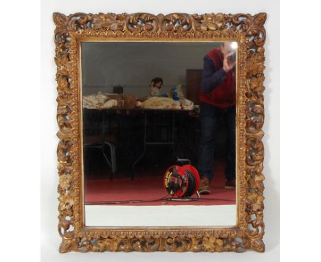 A 19th century continental carved giltwood and gesso picture frame, having later inset mirrorplate, the egg and dart moulded 