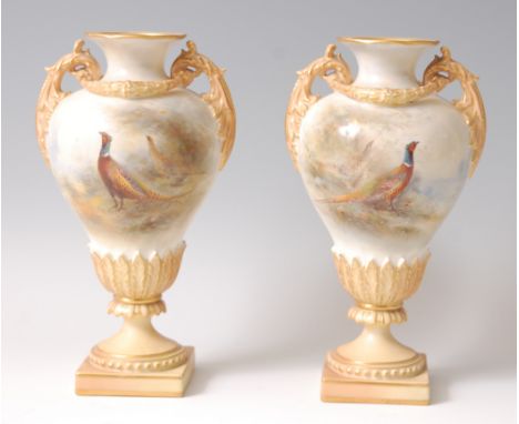 A pair of Royal Worcester porcelain pedestal vases, shape No.1937, each decorated with game-birds within a landscape by James