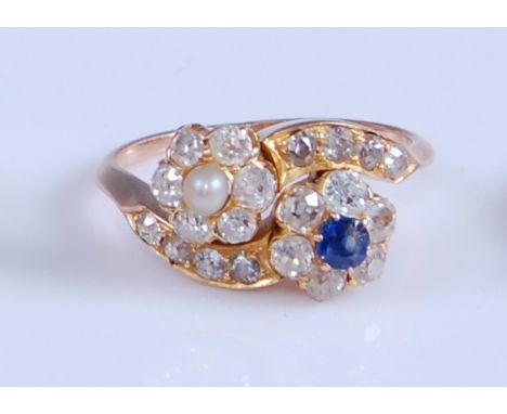 A rose and yellow metal, diamond, sapphire and pearl crossover style double circular cluster ring, featuring two flower shape