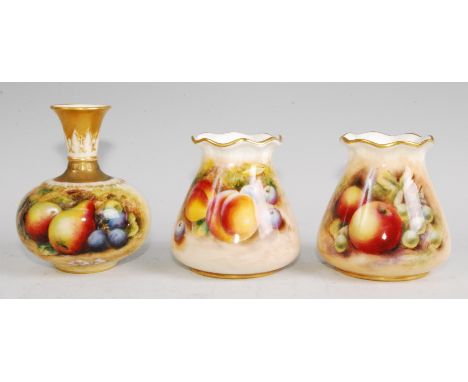 A Worcester porcelain bottle vase, shape No.F110, decorated with fruit on a mossy bank by Lockyer, h.10cm; together with a co