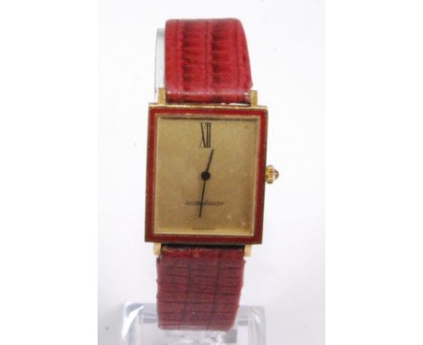A Gents 18ct yellow gold Jaeger le Coultre manual wind wristwatch, having a rectangular champagne dial with Roman numerals '1