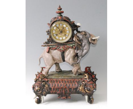 A late 19th century French gilt and bronzed spelter mantel clock, the ornate case modelled as an Indian elephant with howdah 