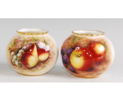 A Royal Worcester porcelain squat vase, shape No.G161, decorated with fruit on a mossy bank by P.D. Love, h.7cm; together wit