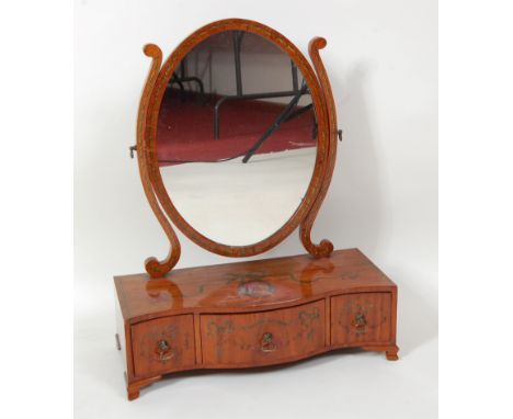 A Sheraton Revival painted satinwood dressing table mirror, the serpentine three drawer boxbase polychrome with a portrait re