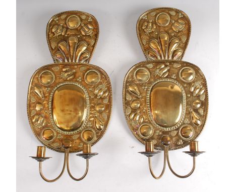 A pair of Dutch brass twin light wall sconces, in the 17th century style, each embossed with fruit and flowers, max h.55cm
