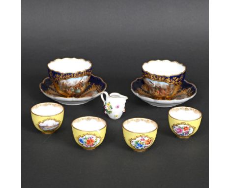 SET OF FOUR MEISSEN PORCELAIN CUPS - DRESDEN. A set of four small porcelain cups, each with a painted panel with a small land