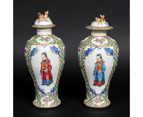 PAIR OF CHINESE FAMILLE ROSE VASES. A pair of 19thc baluster vases, each painted with a Court figure to each side within a pa