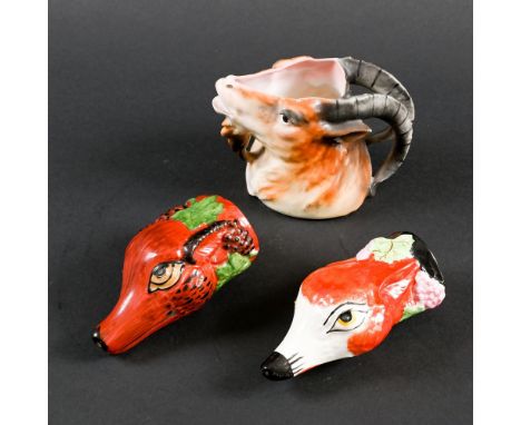 TWO POTTERY STIRRUP CUPS - FOXES. Probably English, two similar pottery stirrup cups in the form of Fox's heads, each painted