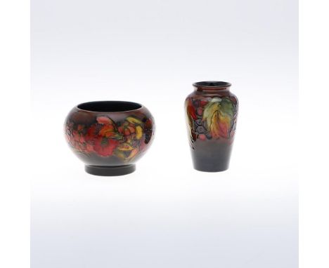 ANTIQUE MOORCROFT FLAMBE BOWL &amp; FLAMBE VASE. A small slender flambe vase in the Leaf and Berry design (10.5cms high), als