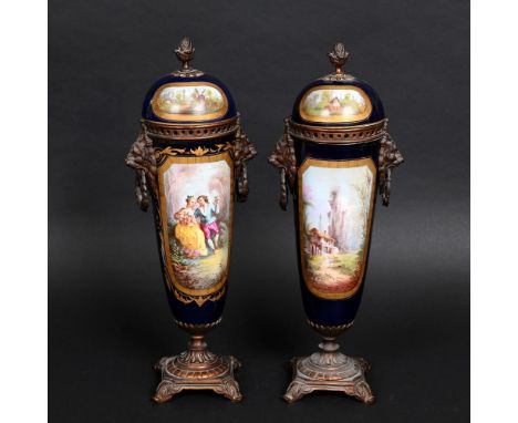 LARGE PAIR OF PORCELAIN CONTINENTAL LIDDED VASES. A large pair of lidded vases, possibly French. Of slender tapering form, pa