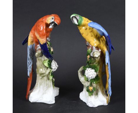 PAIR OF GERMAN SITZENDORF PORCELAIN PARROTS. A large pair of similar porcelain Macaw's, each brightly painted and perched on 