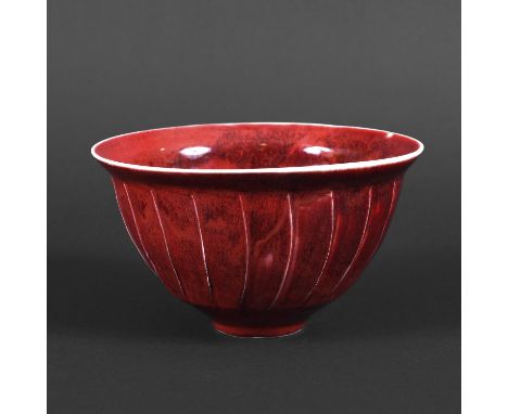 DAVID LEACH (1911-2005) - PORCELAIN BOWL. (d) A fluted porcelain bowl with a copper red glaze, 'DL' seal mark to the base and