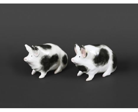 TWO WEMYSS POTTERY PIGS. A similar pair of black and white seated Pigs, both with impressed marks 'Wemyss Ware, R H & S'. 15c