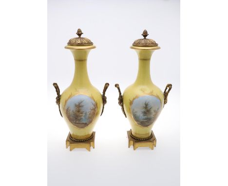 A PAIR OF FRENCH PORCELAIN &amp; BRASS MOUNTED VASES. A pair of large porcelain vases, each painted with a courting couple on