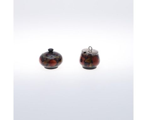 ANTIQUE MOORCROFT LIDDED PRESERVE POT & LIDDED POT. A preserve pot in the Pomegranate design on a blue ground, with a silver 