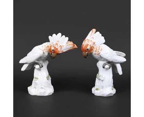 TWO MEISSEN COCKATOO'S. Two similar 20thc models of Cockatoo's, each brightly painted with the birds perched on tree stumps a