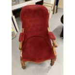 19th cent. Walnut button back nursing chair rising off ceramic castors.