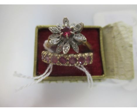 A red hardstone and diamond ruby set daisy style cluster ring, in white metal to a plain yellow metal band stamped 18ct (4.4g