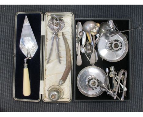 An electroplated patented lemon squeezer, a horn handled cigar lighter, an electroplate commemorative trowel and a pair of el