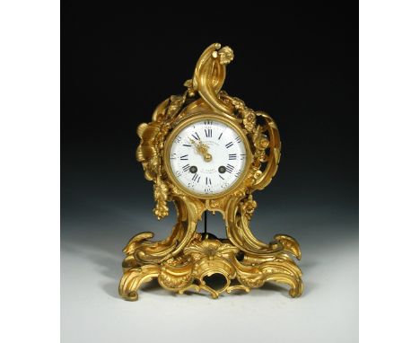 Charpentier & Cie, Bronziers, a Paris, Rue Charlot 8', a Louis XV style ormolu mantel clock, the white dial with slow/fast ad