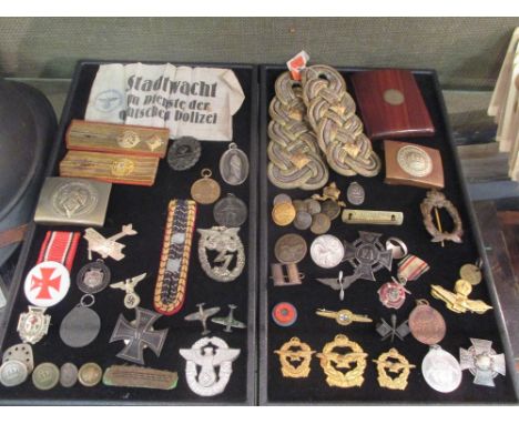 Collection of mixed WWII militaria, badges, buttons, mainly German including a French helmet  