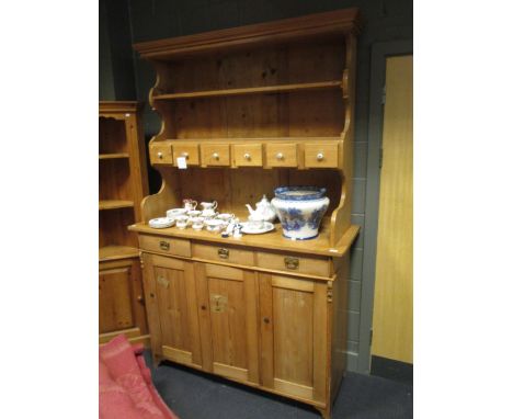 A 19th century Continental pine dresser togeather with an oak three tier wall hanging shelf, 223 x 142 x 51cm  