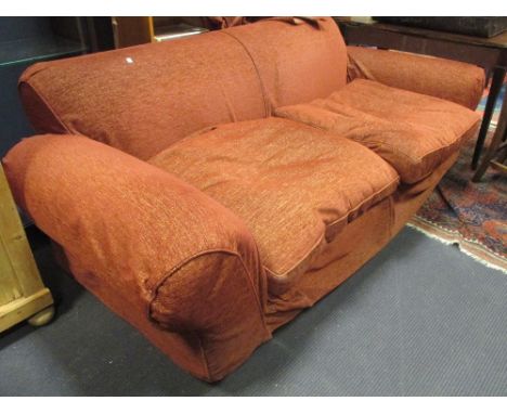 A large modern sofa upholstered in a textured red fabric, on turned legs, 215cm wide approx  
