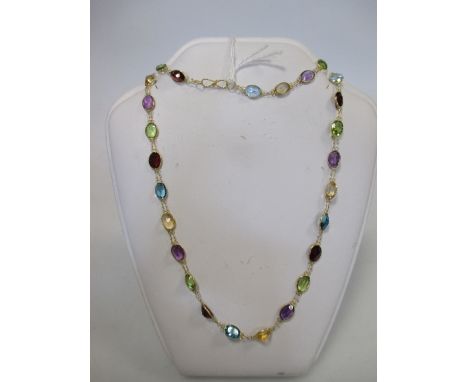 A multi gemset necklace, the oval gemstones including peridot, amethyst, citrine, topaz and garnet, all spectacle set and int
