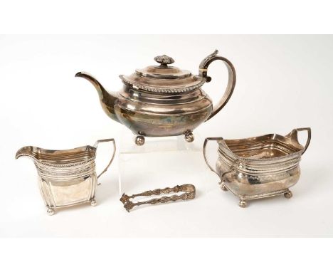 George III silver teapot of compressed baluster form, with gadrooned border, hinged domed cover and silver handle with ivory 