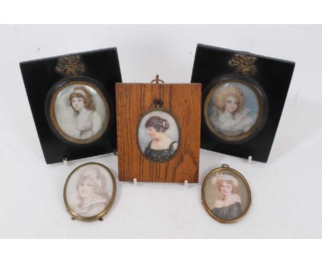 English School, early 19th century portrait miniature on ivory, depicting a young lady with auburn hair, in white empire line