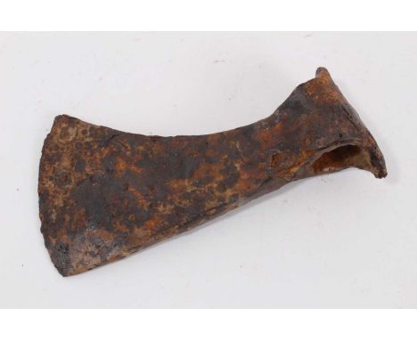 Viking iron battle axe, c.700-900 AD. The curved blade extending downward, below the butt of the axehead, lozenge-shaped poll