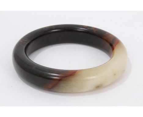 Chinese mottled jade bangle, 9cm diameter