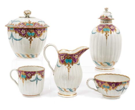 A rare suite of 18th century Worcester porcelain, possibly painted by James Giles, including a cream jug, tea caddy, sucrier,