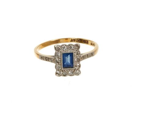 Early 20th century 18ct gold sapphire and diamond rectangular cluster ring with a rectangular step cut blue sapphire measurin