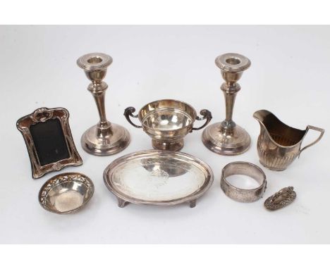 Selection of miscellaneous silver, including pair candlesticks, small photograph frame, sugar, cream jug, teapot stand, bangl